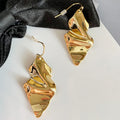 2026 New Arrival Fashion Jewelry Metal Texture Irregular Exaggerate Cold Geometric Curved Metal Hammered Long Leaf Gold Earrings