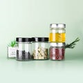 Empty Pickle Packaging 50ml 100ML 250ML 500ML Condiment Pet Cans Clear Glass Storage Jar with Metal Lids