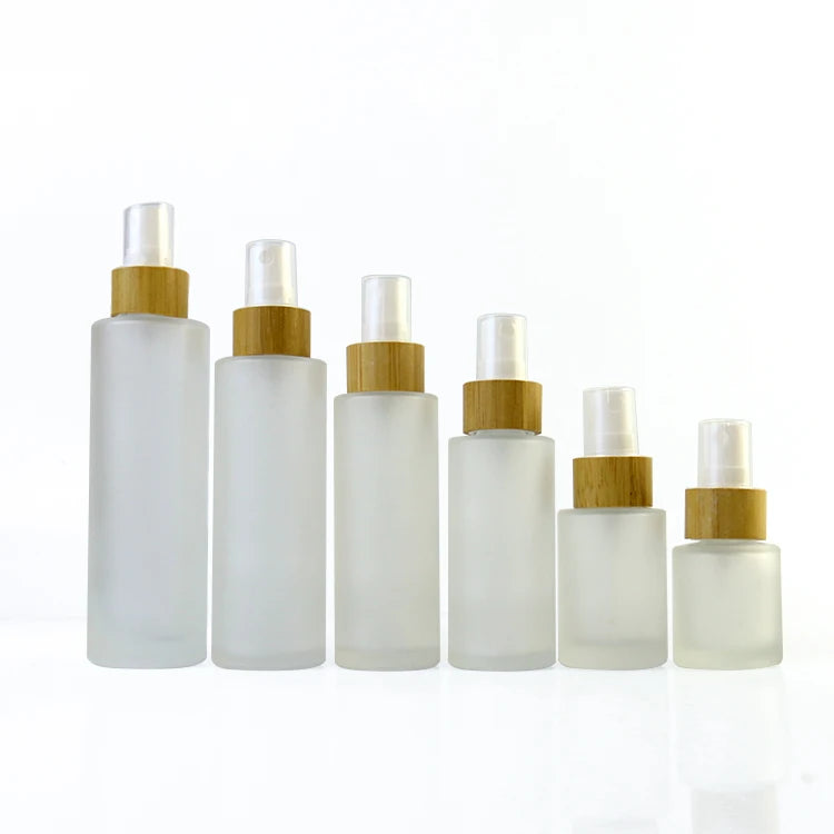 Hot Sale 100ml 120ml 150ml Bamboo Spray Lotion Pump Flat Shoulder clear Frosted Glass Bottle