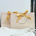 Unique Apricot Beige Cream Custom Clothes/shoes Paper Bag Gift Packaging With Ribbon Handles Bow Paper Party Gift Bags for Kids