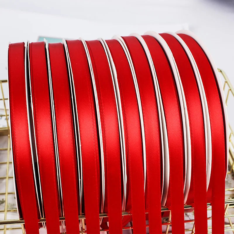 Factory Wholesale Customized Christmas Gift Satin Ribbon 100% Polyester Double Sided Solid Red Sizes 1cm 2.5 cm 4 cm