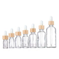 in Stock Clear Glass Oil Dropper Bottle 5ml to 100ml Sizes with Bamboo Dropper for Essential Oils and Face Creams