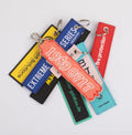 Custom Promotional Logo Anime Remove Before a Flight Crew Double Sided Woven Fabric Embroidery Embroidered Key Jet Tag Keychain