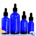 Luxury Blue Glass Essential Oil Dropper Bottle 30ml 50ml 100ml with Spray Cap for Cosmetic Eye Drops and Skin Care Serums