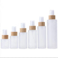 Fancy Beauty 20ml 30ml 40ml 50ml 60ml 80ml 100ml 120ml Flat Shoulder Frosted clear Glass Spray Bottle With Real Bamboo Pump