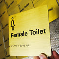 Restroom Metal Ada Sign with Man Women Compliant Raised Tactile Text
