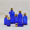 Free Sample 5ml 10ml 15ml Blue Glass Cosmetic Bottles 20ml 30ml 50ml 100ml Essential Oil Dropper Bottle with Gold Ring