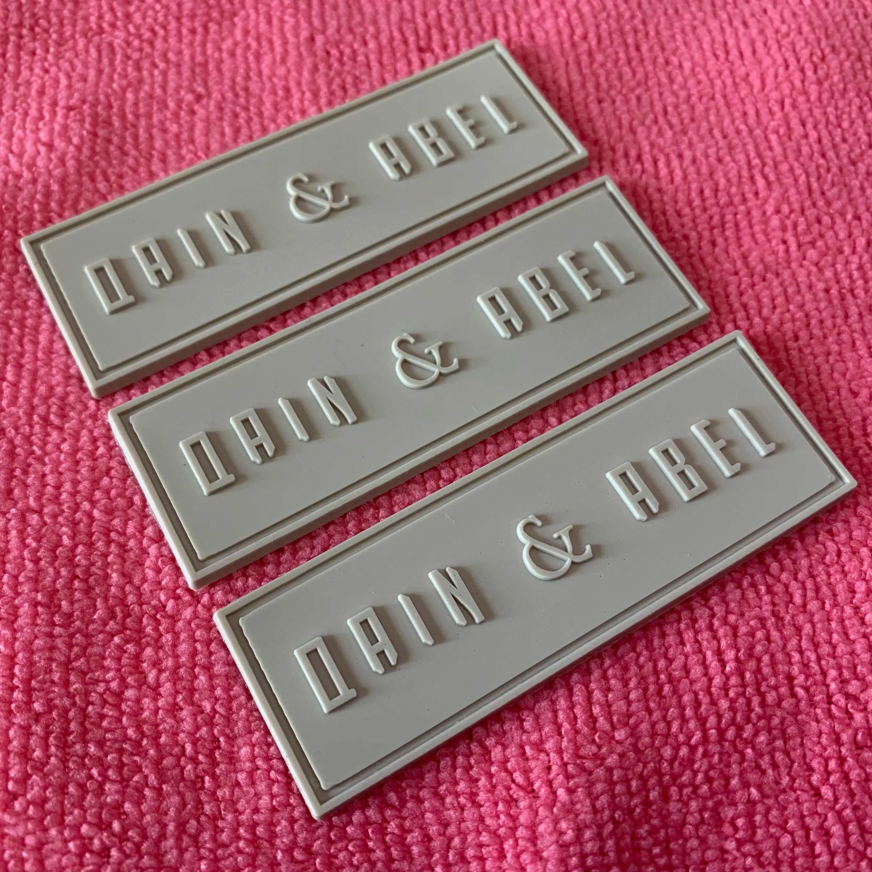 Solid Color Embossed logo PVC Rubber Label for Bagscheap Price Swimwear Rubber Patch With Stitching Dent