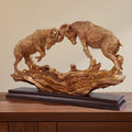 Golden Ram Duel Resin Sculpture on Wood BaseFighting Bighorn Sheep Statue with Interlocked Horns Wilderness Theme Tabletop Art