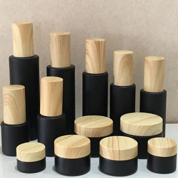 Cosmetics Frosted Glass Bottle Black Perfume Fine Mist Spray Bottle Black Essence Oil Lotion Pump Bottle With Wood Grain Cover