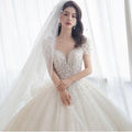 2023 Princess Short Sleeves Luxury Wedding Dress Floor Length Applique Beaded Ball Gowns Lace-up Ivory Vintage Real Dress
