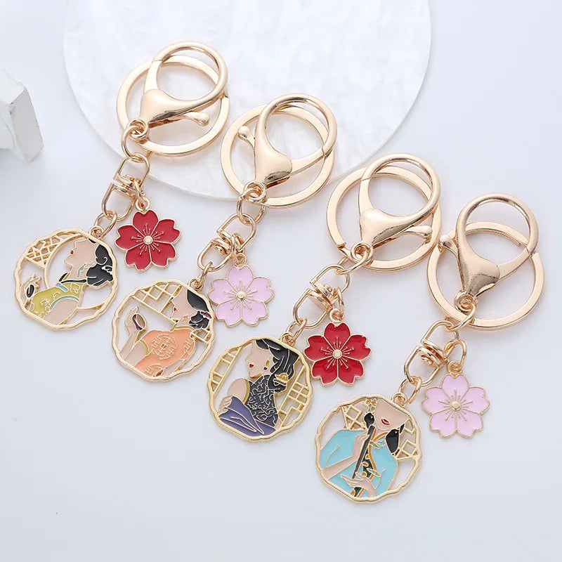 Chinese Style Antiquity Cheongsam Beauty Keychains Women Gold Color Alloy Drip Oil Flower Key Chain Car Bag Pendant Gift