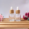 Stock 15ml clear Slop Shoulder Oil Serum Glass Bottle with Bamboo Dropper