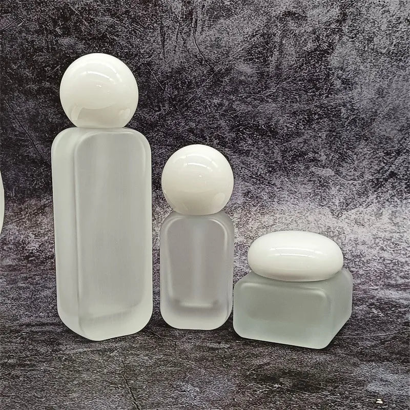 Wholesale Empty Frosted Glass Lotion Jar for Skin Care 30g 50g Cosmetic Pump Glass Bottle Manufacturers