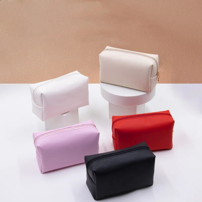New Fashion Design Private Label Custom Logo PU Leather Hand Bags Ladies Women Leather Pouches Plain Pink Makeup Bag
