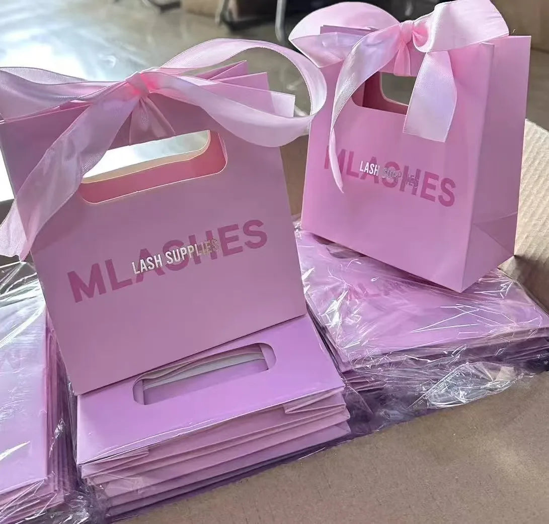 Custom Luxury Pink Shopping Paper Bags for the Boutique Collection Gift Packaging Bags with Ribbon