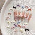 Paso Sico 30Pcs 3D Ribbon Bow Nail Art Accessories Soft Carved French Style DIY Bow Tie Diamond Nail Art Decoration for DIY