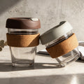 Hot Sell Transparent Cork Sleeve Reusable Glass Coffee Cup With Silicone Lid Anti-scald Glass Cup Insulated To-Go Coffee Cup