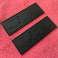 Solid Color Engrave Logo Silicone Rubber Plastic LabelSingle Color Debossed Brand Soft PVC Plastic Label with Sewing Dent