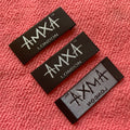 Embossed logo Black Satin Woven Labelglossy Surface Satin Neck Label With Brand