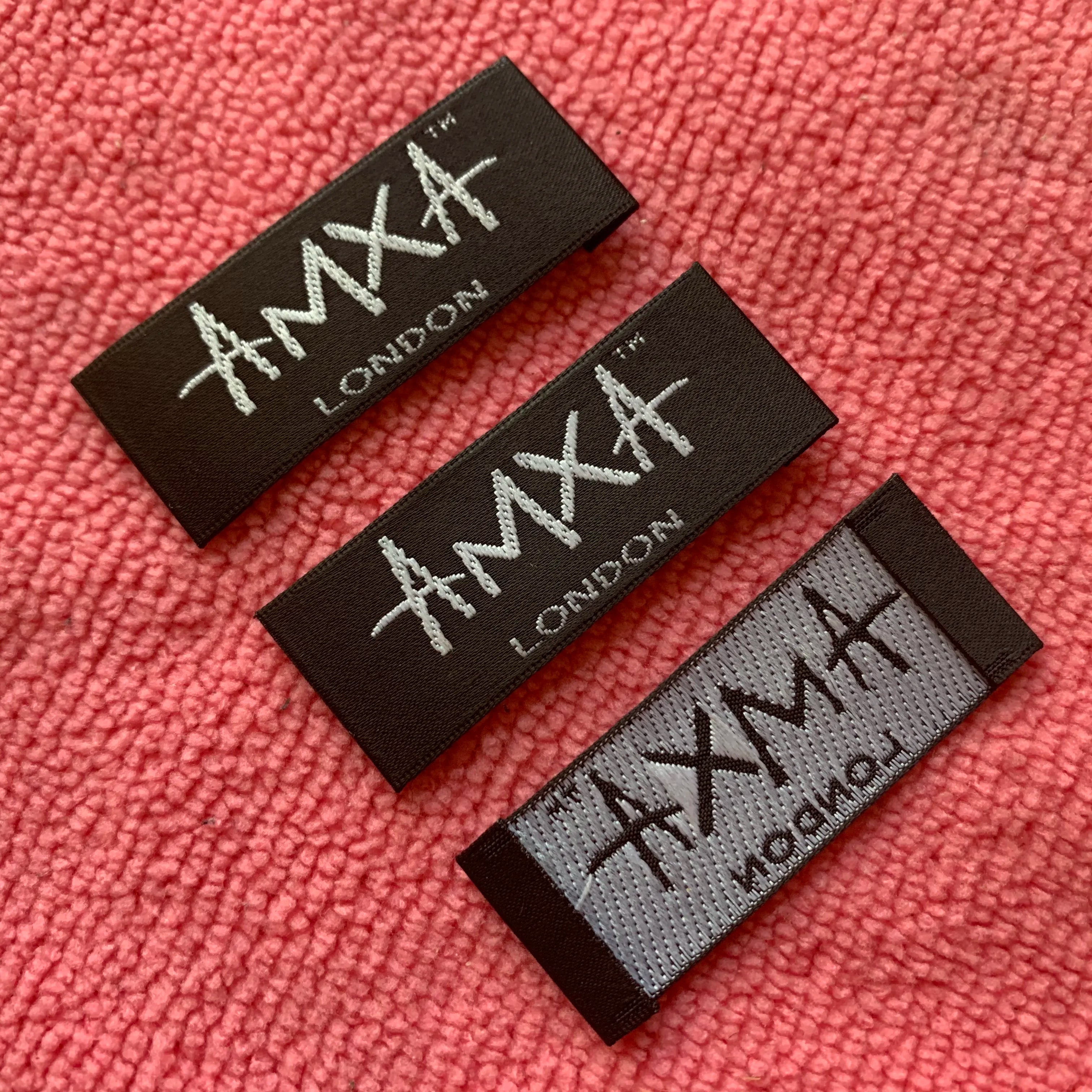 Embossed logo Black Satin Woven Labelglossy Surface Satin Neck Label With Brand