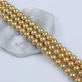 Zhuji Wholesale 10mm 12mm 14mm Shell of Round Pearl Natural Gold Stands for Sale
