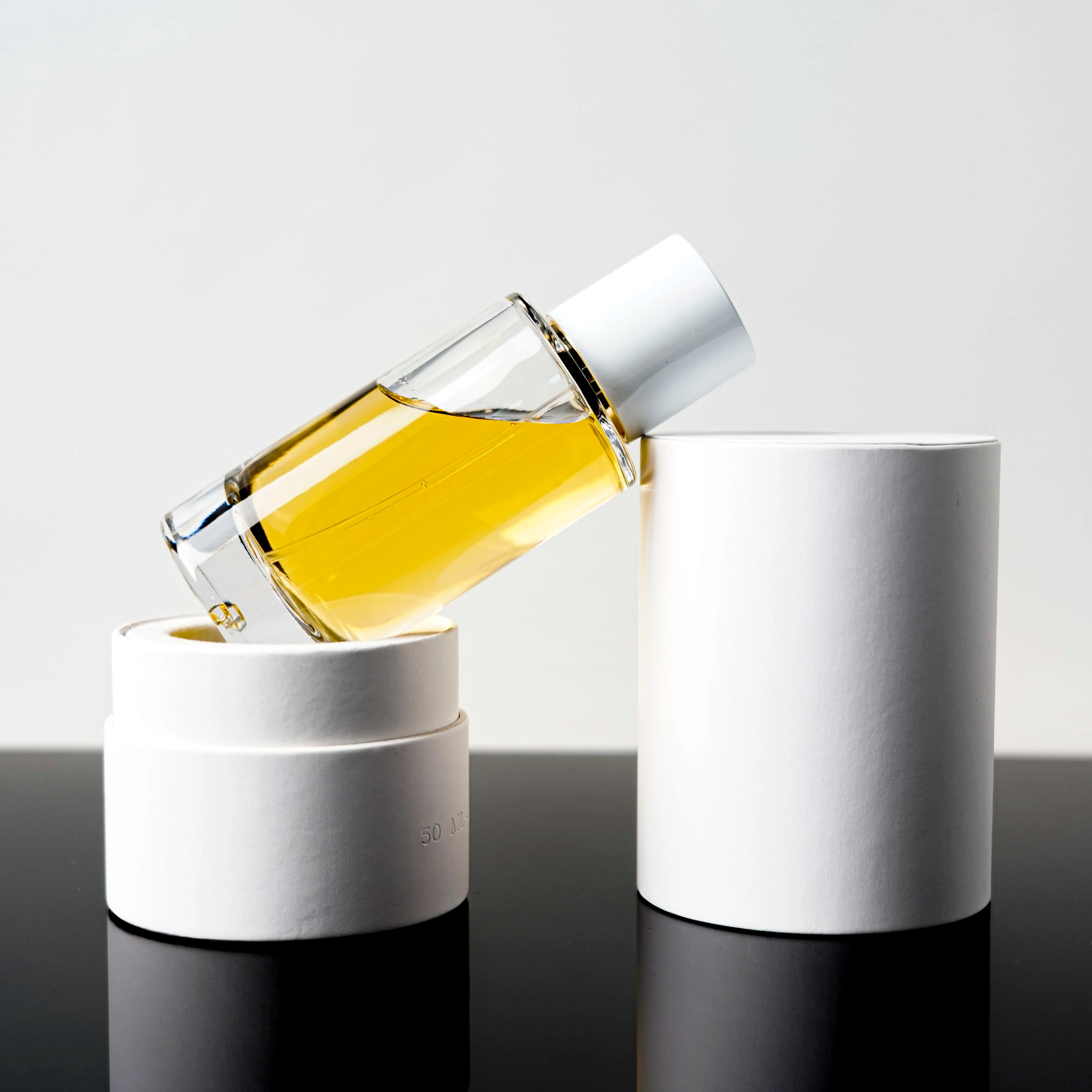 50ml 100ml Custom Round Empty Clear Fragrance Glass Perfume Bottle Perfume Glass Bottles with Spray Pump
