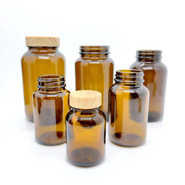 Wholesale Empty Amber Glass Capsule Bottles Heavy Glass Wide Mouth Packer Medicine Bottles With Caps Liner Powder Jar