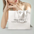 Wholesale Custom Logo Pink Paper Bag Packaging Garment Storage Shopping Carry Bag for Apparel High Quality Cosmetics Retail Bag