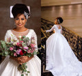 Dubai Arabic Wedding Dresses Applique Lace Beaded Sheer Jewel Neck Long Sleeves Crystals Pearls Wedding Dress Bridal Gowns