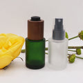 Flat Shoulder Green 30ml 100ml 1 oz Glass Dropper Bottles  with Dark Wooden  Push Button Dropper