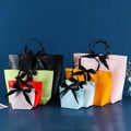 Luxury Colorful Printing Paper Gift Bags Custom Design logo Boat Shape Paper Shopping Bag with Handle Ribbon