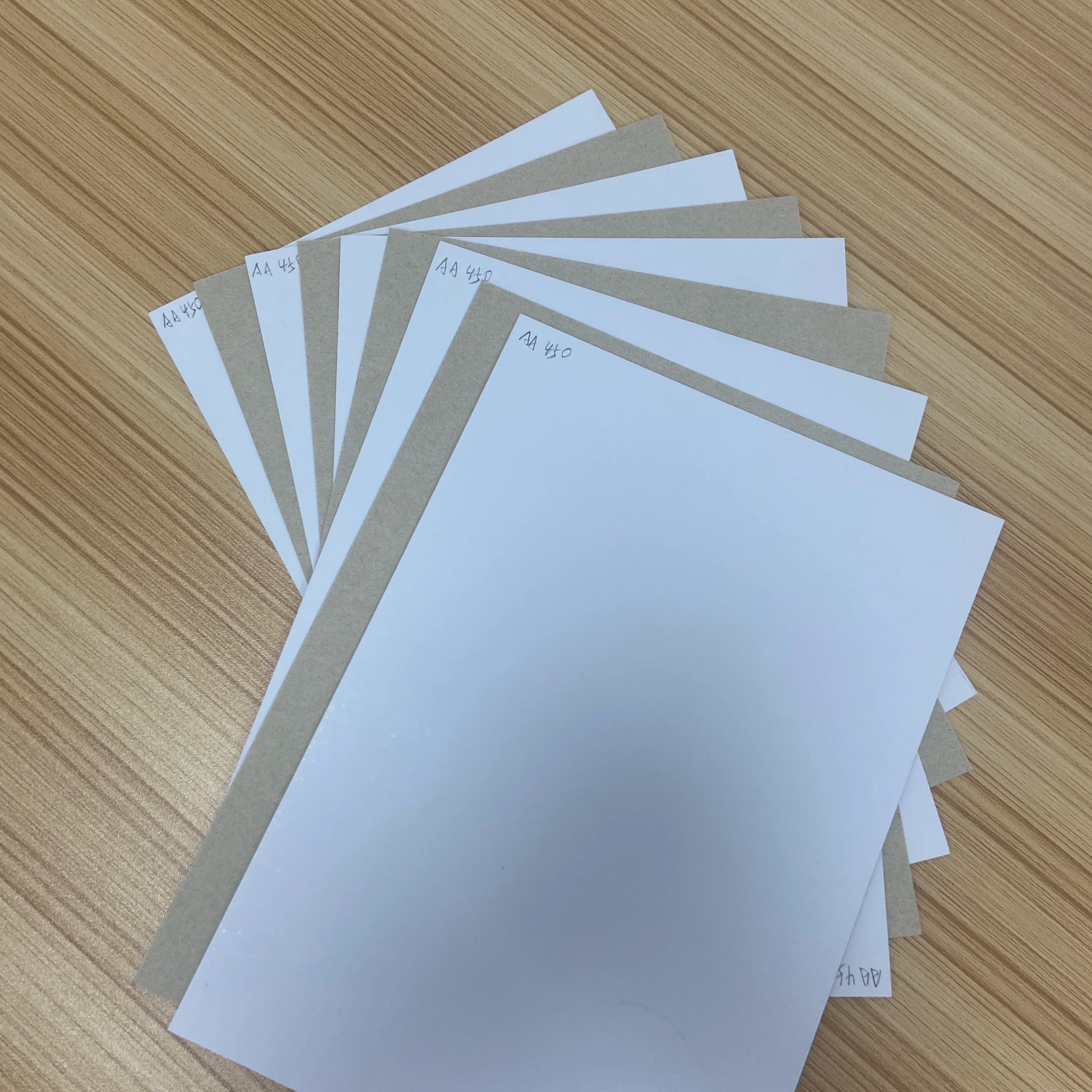 250gsm 290gsm 340gsm Strong Stiff Coated Single Side Moisture Proof Duplex Board Paper with Grey Back for Printing Clothing Pad