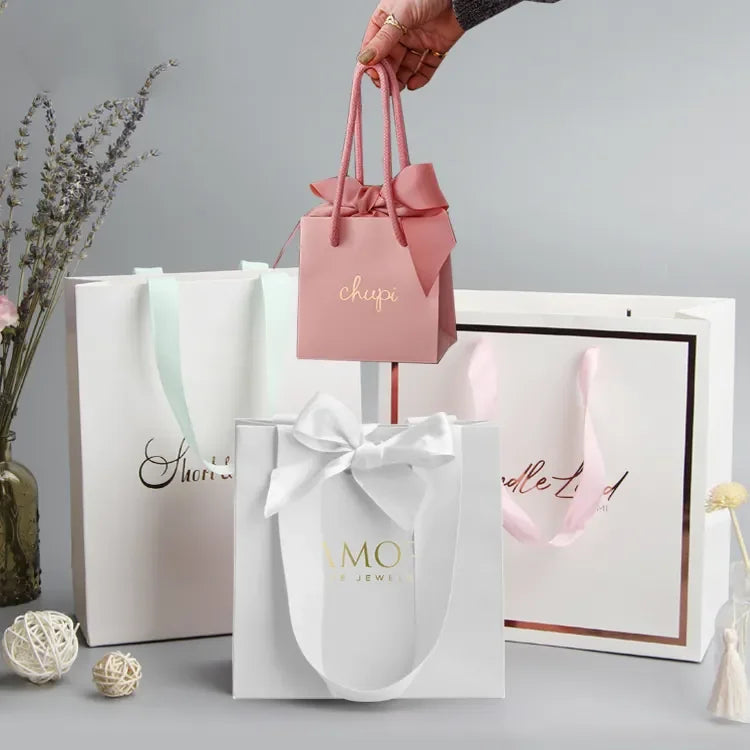 Manufacturer Custom Logo Art Paper Bags Lamination Ribbon Jewelry Cosmetics Luxury Packaging Bag Gift Bags