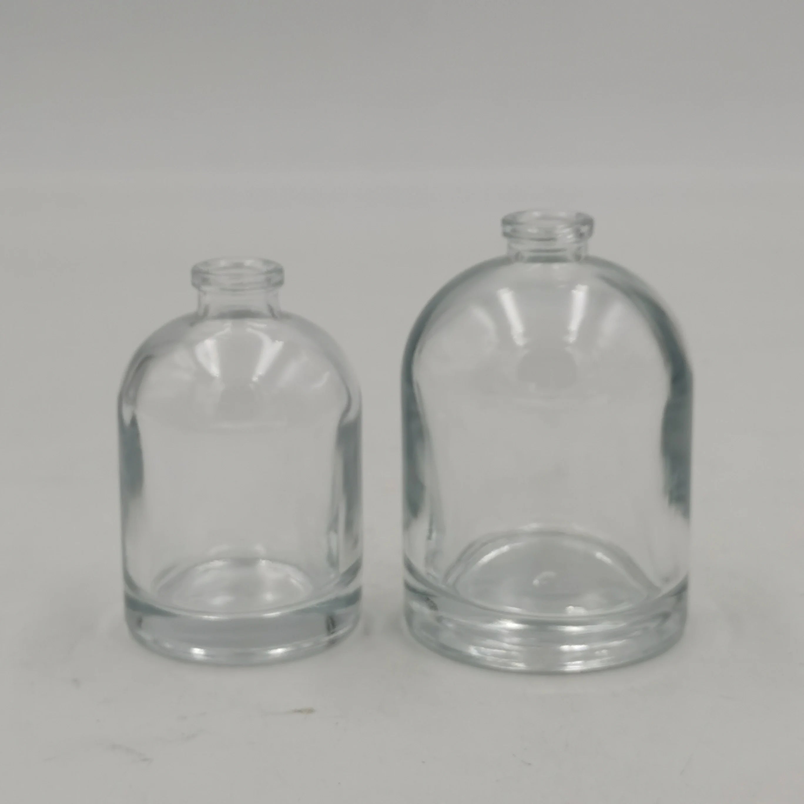 In Stock Factory 30ml 50ml 100ml Round Shape Glass Empty Perfume Bottle with Pump Spray Custom Cover Engraving Available