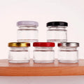 Cheap Wholesale Empty Round Mini 1oz 30ml 45ml Small Glass Honey Jar With Lids