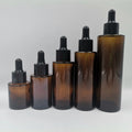 Wholesale Luxury Flat Shoulder Glass Dropper Bottle Transparent Frosted Black Oil Serum Roller Pump Spray Cap Amber Color