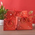 Custom Luxury Red Color Recycled Materials White Cardboard Shopping Gift Bag with Bowknot for Valentine's Day Gift Packaging