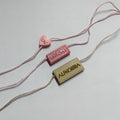 YH-ST07 Garment Clothing Seal Tags Maker Custom 3D Embossed Brand Name Logo Plastic Hang Tags Polyester String Locks for Shoes