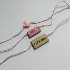 YH-ST07 Garment Clothing Seal Tags Maker Custom 3D Embossed Brand Name Logo Plastic Hang Tags Polyester String Locks for Shoes