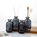 Eco-friendly 100ml 150ml Empty Reed Diffuser Bottle Custom Color Glass Fragrance Bottle with Sphere Cap for Essential Oil Aroma