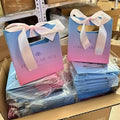 New Luxury Custom Your Own logo Shopping Paper Bag for Clothes pink Matte Clothing Boutique Packaging Bags with Ribbon Handles