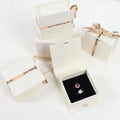 Premium White Ribbon Gift Box for Perfume Durable Paperboard Gold Foil Embossing Offset Printing UV Coating Glossy Lamination