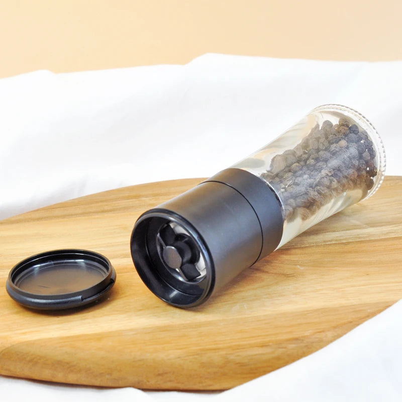 China Supplier's Manual Dry Spice Grinder with Plastic Lid Glass Jar and Screw Cap for Salt & Pepper Packaging