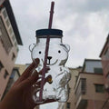 New Stock Cute Bear Shape Glass Cup 20oz 590ml Green Hat Bottles Beer Custom logo Glasses Teddy Bear Glass Bottle with Lid Straw