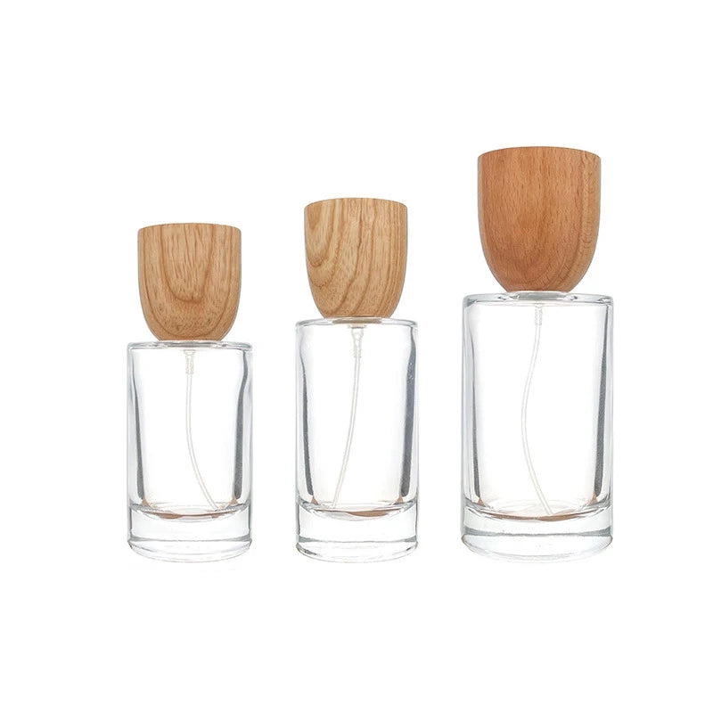 New Design Luxury 30ml 50ml 100ml Round Perfume Glass Bottle Empty Perfume Oil Pump Glass Spray Bottle With Wood Bamboo Lid