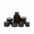 Wholesale Luxury Custom Black Frosted Amber 2oz 30ml 50ml 100ml Face Cream Cosmetic Glass Jars With Lids