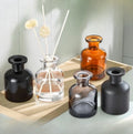 Luxury Eco-friendly 50ml 100ml 150ml 250ml Black Frosted Gray Amber Cylinder Reed Diffuser Glass Bottle Cork Cap Customizable