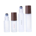 Low Moq Cosmetic Essential Oil Perfume 5ml 10ml Custom logo Frosted Glass Roller Bottle with Dark Wooden Cap
