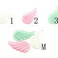 China Suppliers Glitter Angel Wing Resin 22*40mm Flatback Cabochon Loose Stickers Wedding Decoration MegaBDM